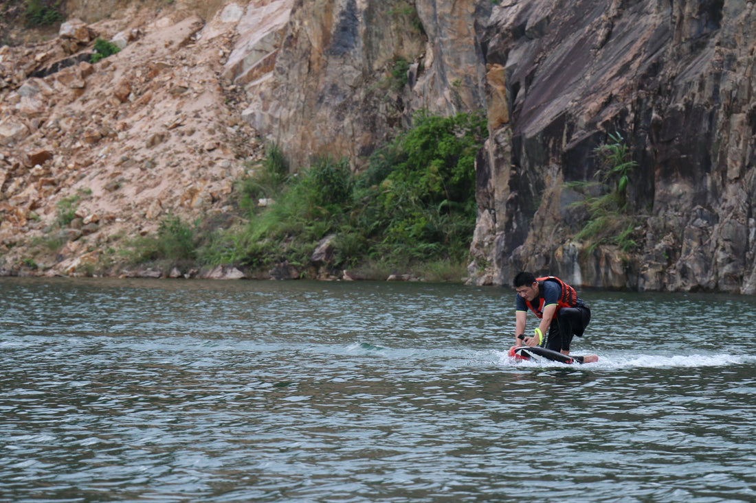 Rider gliding above ocean on ASUFUN efoil, showcasing silent power, speed, and the future of surfing.