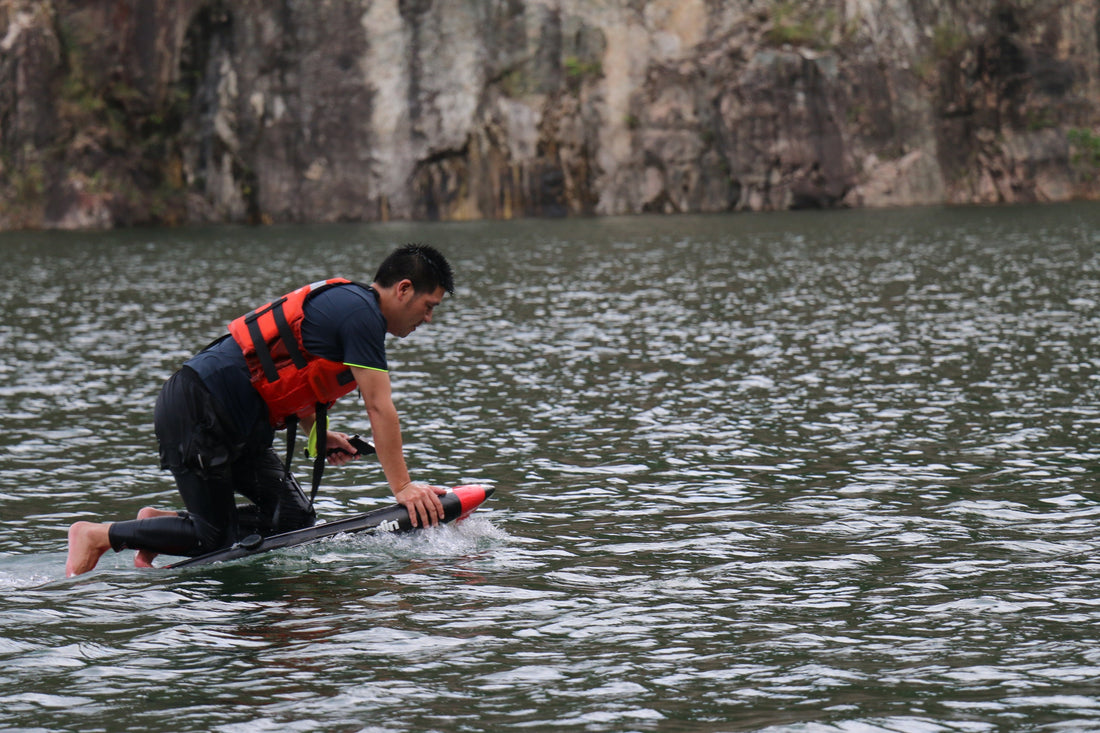 Rider soaring above the ocean on an ASUFUN efoil, showcasing power, balance, and the freedom of modern foiling.