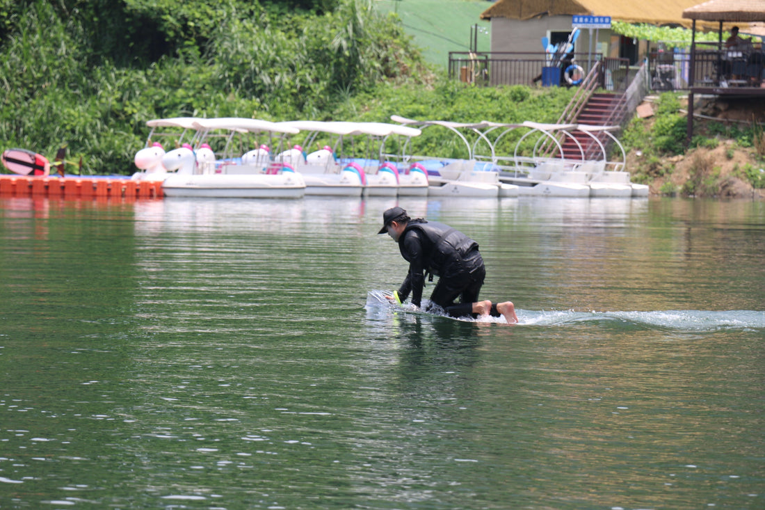 Rider gliding above waves on an ASUFUN efoil, showcasing power, balance, and the freedom of water flight.