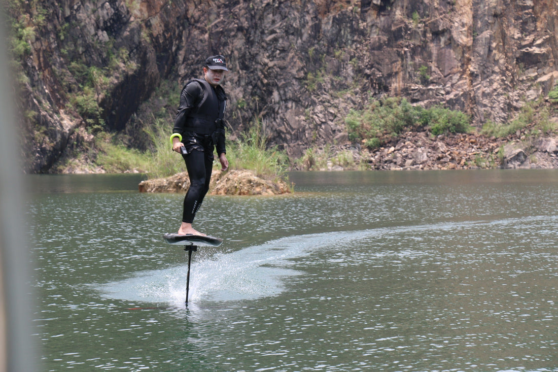 Rider soaring above the ocean on an ASUFUN electric hydrofoil, showcasing smooth lift, power, and futuristic freedom.