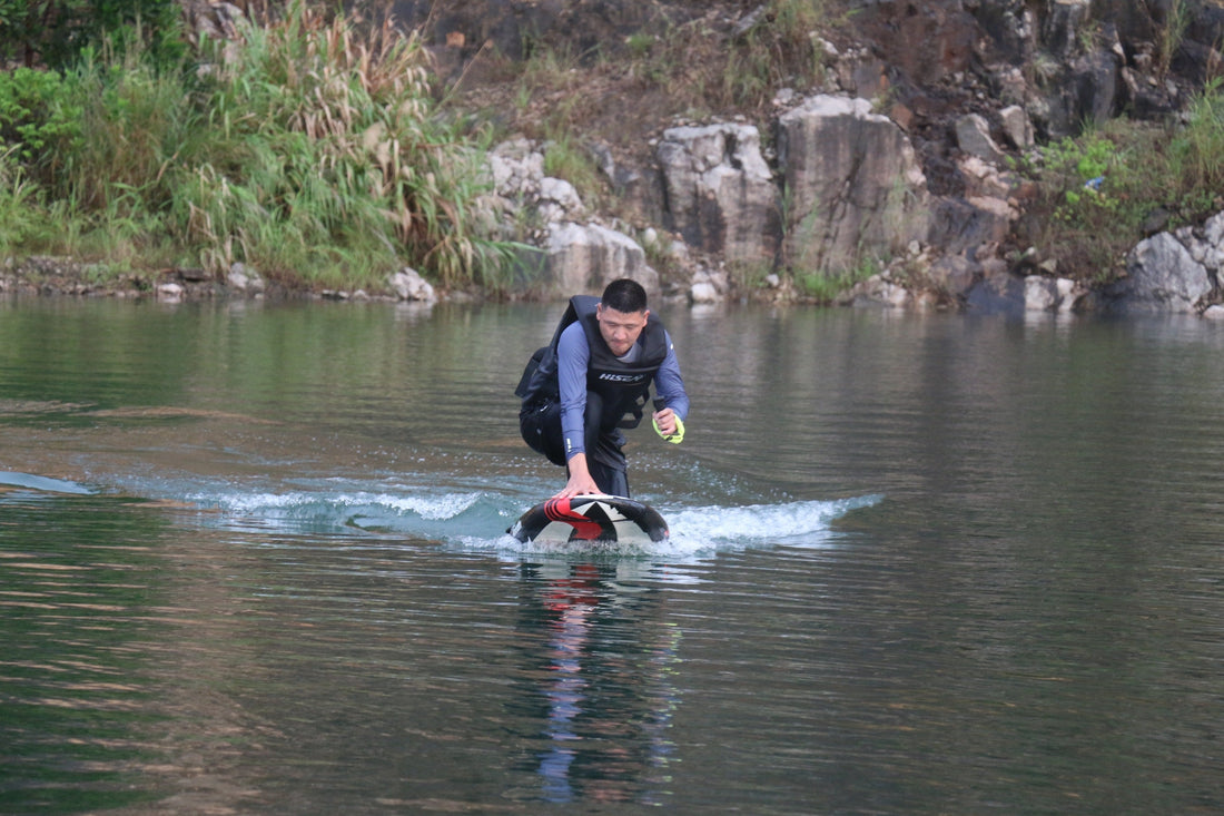 wing foiling Hawaii electric hydrofoil rider cruising calmly on flat water