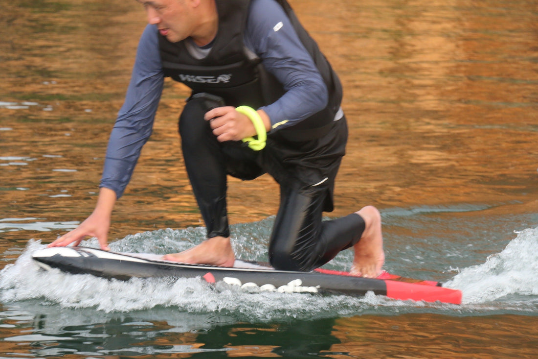 An eFoil beginner practicing takeoff and control on a calm lake