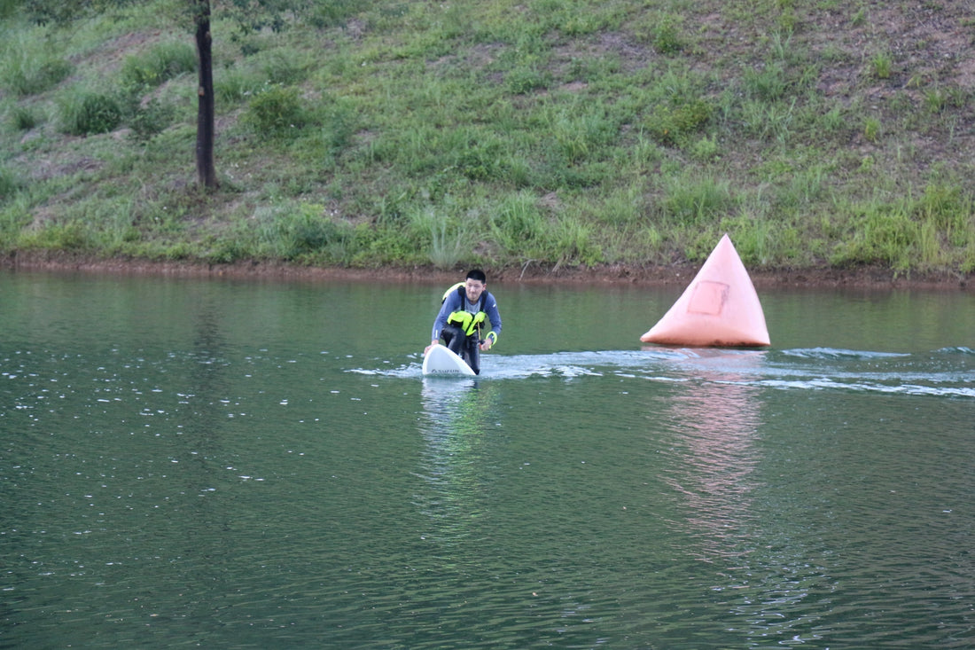 An eFoil rider enjoying a smooth ride on a calm lake